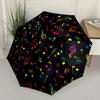 Folding umbrella Colorful musical notes pattern, black background. Creative portable folding umbrella Christmas and other holi