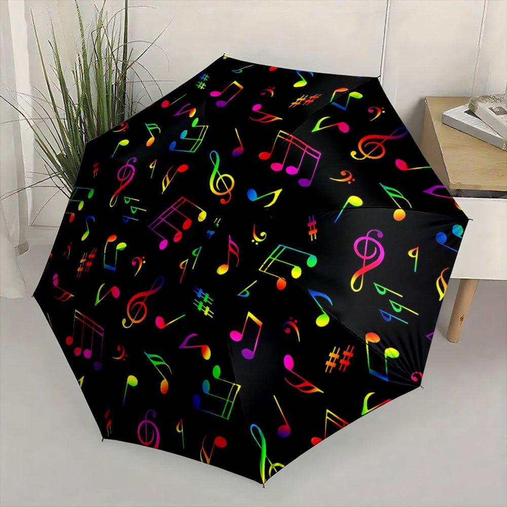 Folding umbrella Colorful musical notes pattern, black background. Creative portable folding umbrella Christmas and other holi