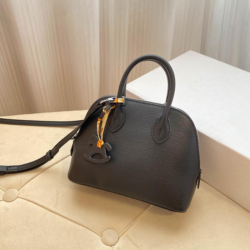 Премиальная мини-сумка-ракушка для женщин 2025 года, новая модная иностранная стильная изысканная сумка для переноски на одно плечо, диагональный пролет, воловья кожа, маленькая