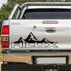 Наклейки на двери и багажник пикапа Toyota Hilux Revo Vigo "Горы"