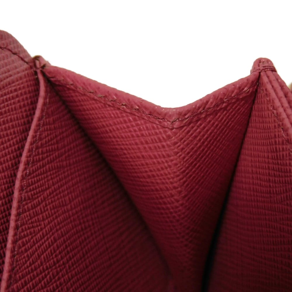 Подержанный 11569 Кошелек для монет Saffiano 1MM268 QHH F0505 7943 Розовый Картхолдер на молнии с треугольным логотипом Peonia Женский от