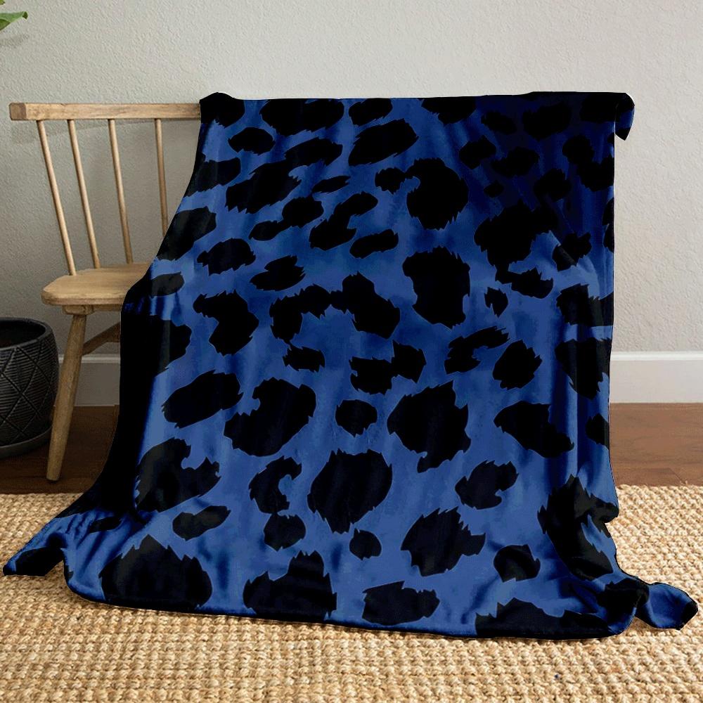 Black irregular leopard spots on a blue background. for all seasons blanket lunch break throw gift