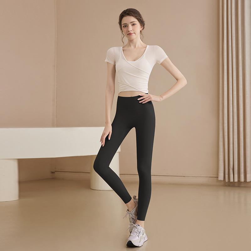 Mesh yoga clothes top women's 1011 new summer fitness clothes Pilates new short-sleeved wholesale with chest pads