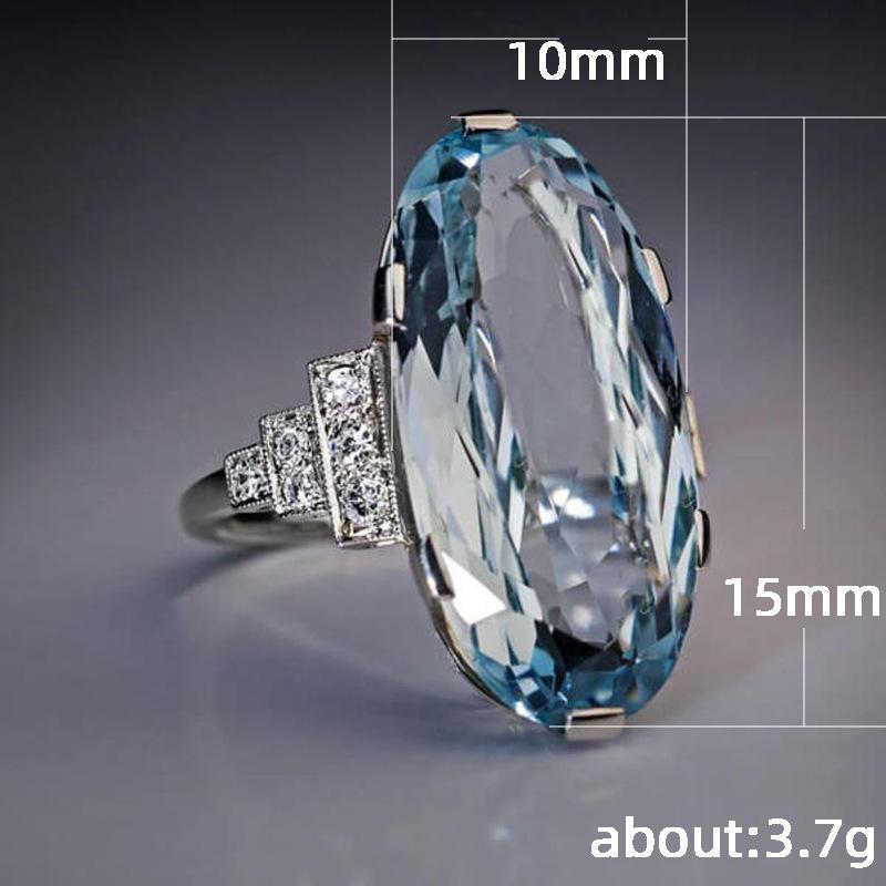 Fashionable Oval Blue Zircon Ring with Large Grain Design in Alloy