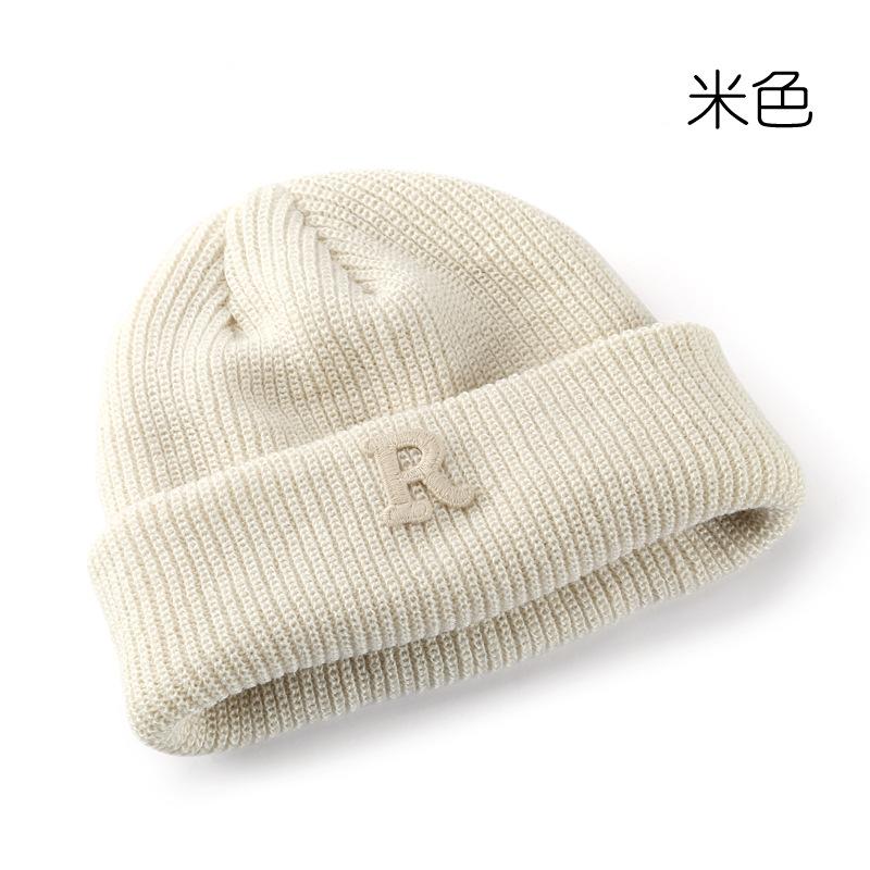 Women's Solid Color Letter Print R Rolled brim knitted hat for outdoor cycling, providing warmth, cold protection, and ear coverage