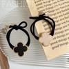 Korean High-End Four-Leaf Clover Hair Tie for Women - Non-Tightening Summer Ponytail Accessory with Black Leather Case