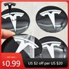 Автомобильная наклейка 2025 Новая 4 шт. 56 мм Черно-белая Колпачок Tesla Колпачок центральной ступицы Наклейка с логотипом для Tesla Model 3 Y S X Персонализированный автомобиль
