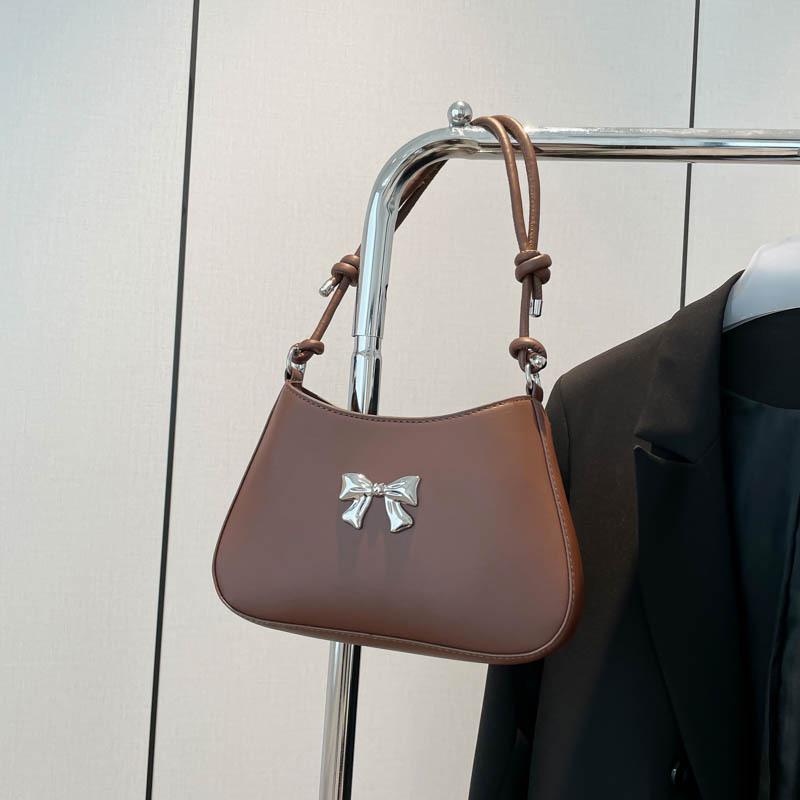 Осень новая нишевая сумка через плечо милая и свежая сумка подмышку с бантом для通勤, темпераментная ручная сумка