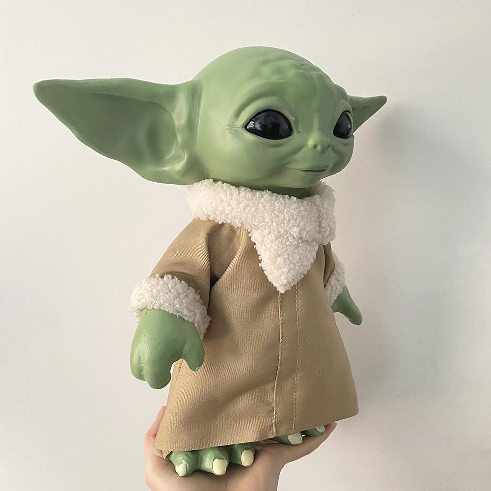 Star Wars merchandise: Yoda baby figurine, infant Yoda vinyl doll, Mandalorian action figure