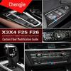 Модификация интерьера BMW X3/X4 F25/F26 из углеродного волокна: Отделка центральной консоли, рычага переключения передач, кондиционера и стеклоподъемников.