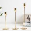 Elegant European Candle Holder Set: Electroplated Three-Piece Metal Ornament for High-End Dining and Wedding Décor.