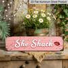 2D Flat - A Single Metal Sign Measuring 15.7X3.94 Inches In A Rustic Pink Color, Featuring The Phrase 'She Shack'- Aluminum Decorative Sign. This