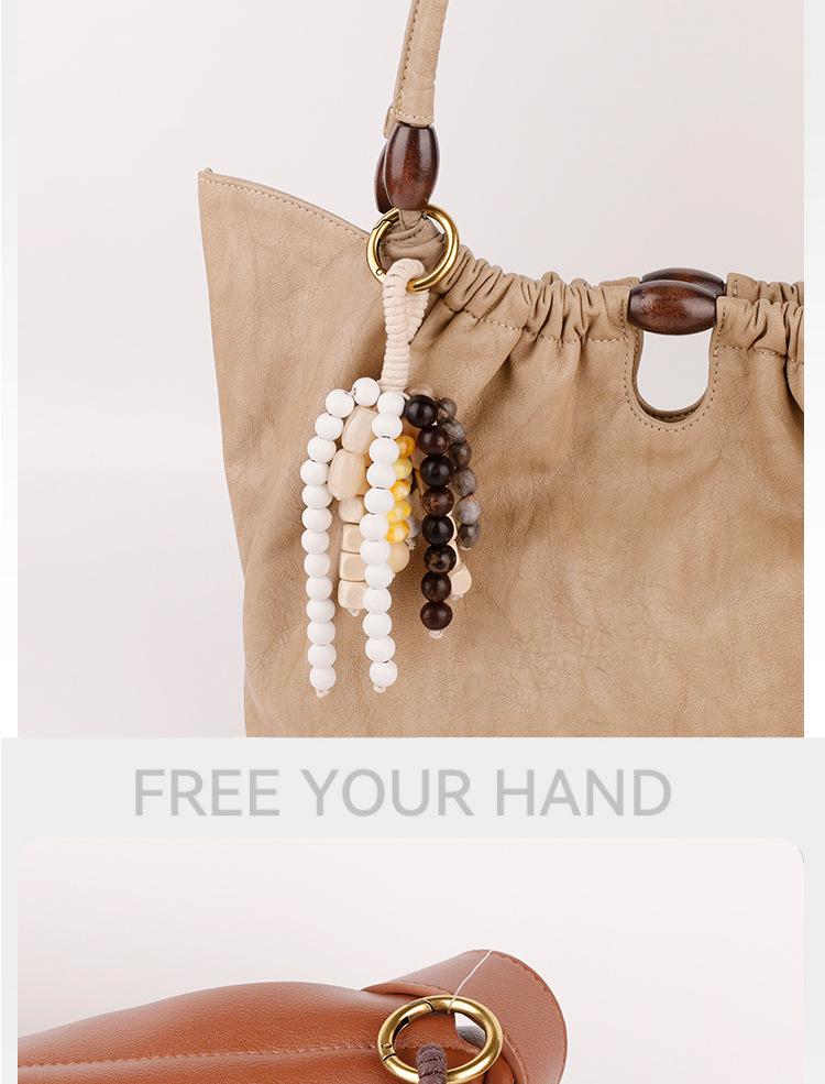 Wish-Fulfilling Bodhi Seed String Bag Charm - Hand-Woven Natural Keychain Ornament with Turquoise.