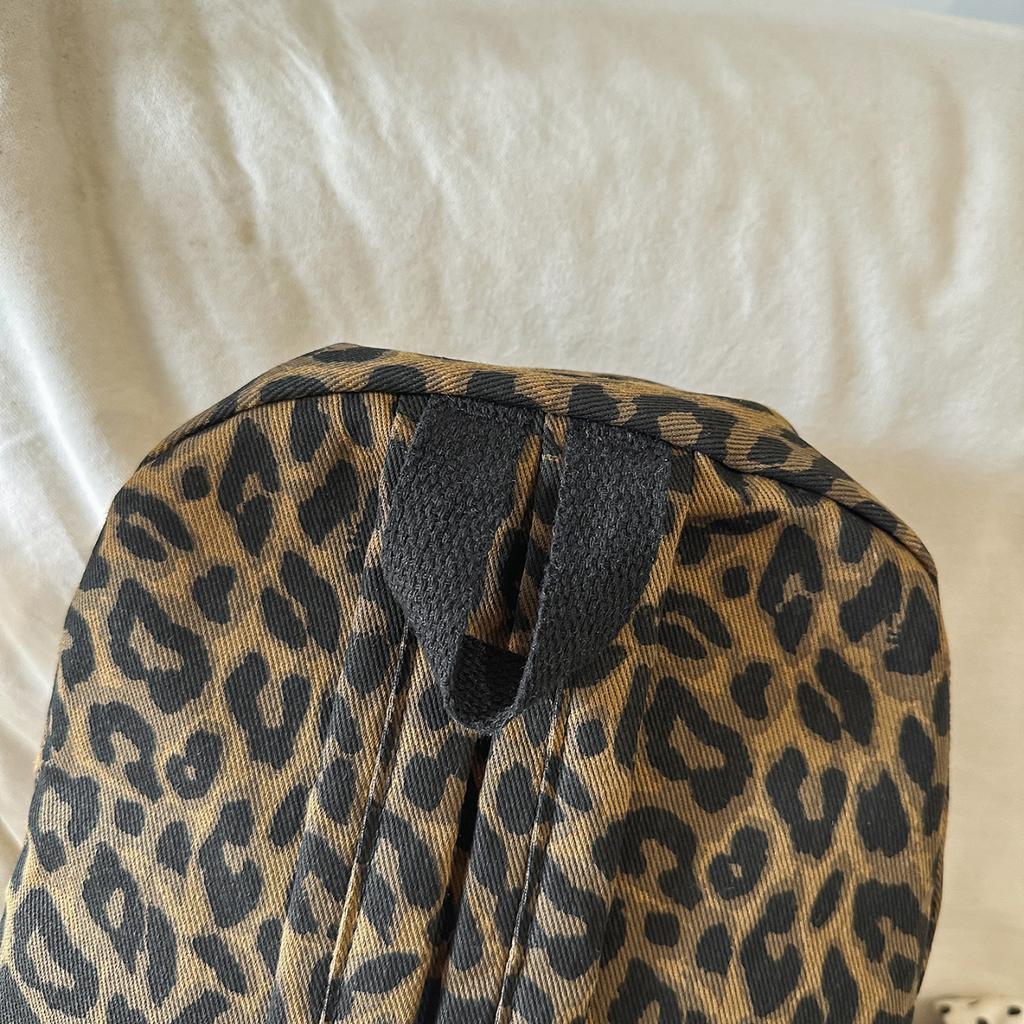 Рюкзак с леопардовым принтом Повседневный Модный уличный стиль Легкий рюкзак для женщин с деталью в виде кисточки для школы, путешествий и повседневных прогулок