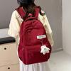 Trendy Red Backpack for Women Large Capacity Lightweight School Bag Casual Travel and Daily Commuter Bag with Cute Pendant