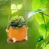 Creative Multifunctional Orange Swing Planter Pot With Swing Feature Suitable for Kids Entertainment and Home Gardening