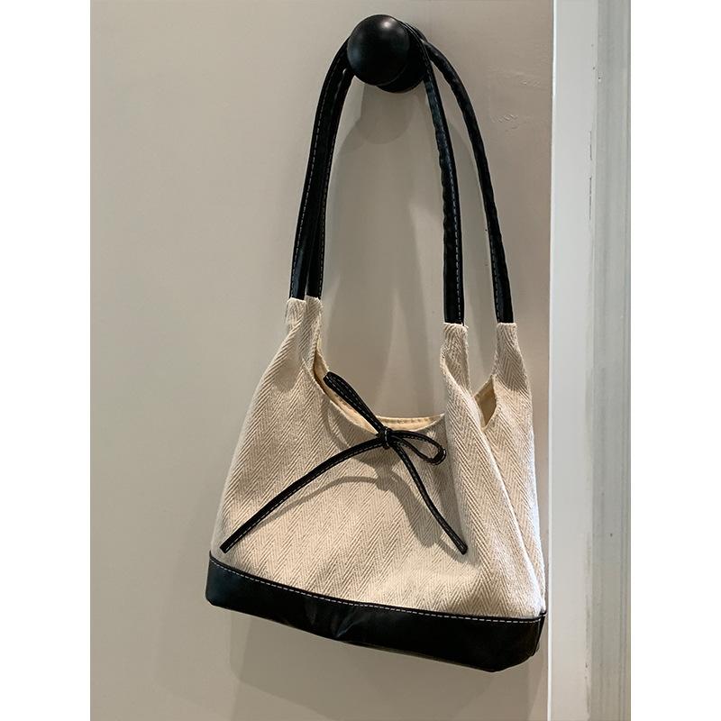 Корейская сумка-тоут Ins Canvas Bow для женщин, новая высококачественная нишевая студенческая универсальная сумка-ведро на одно плечо