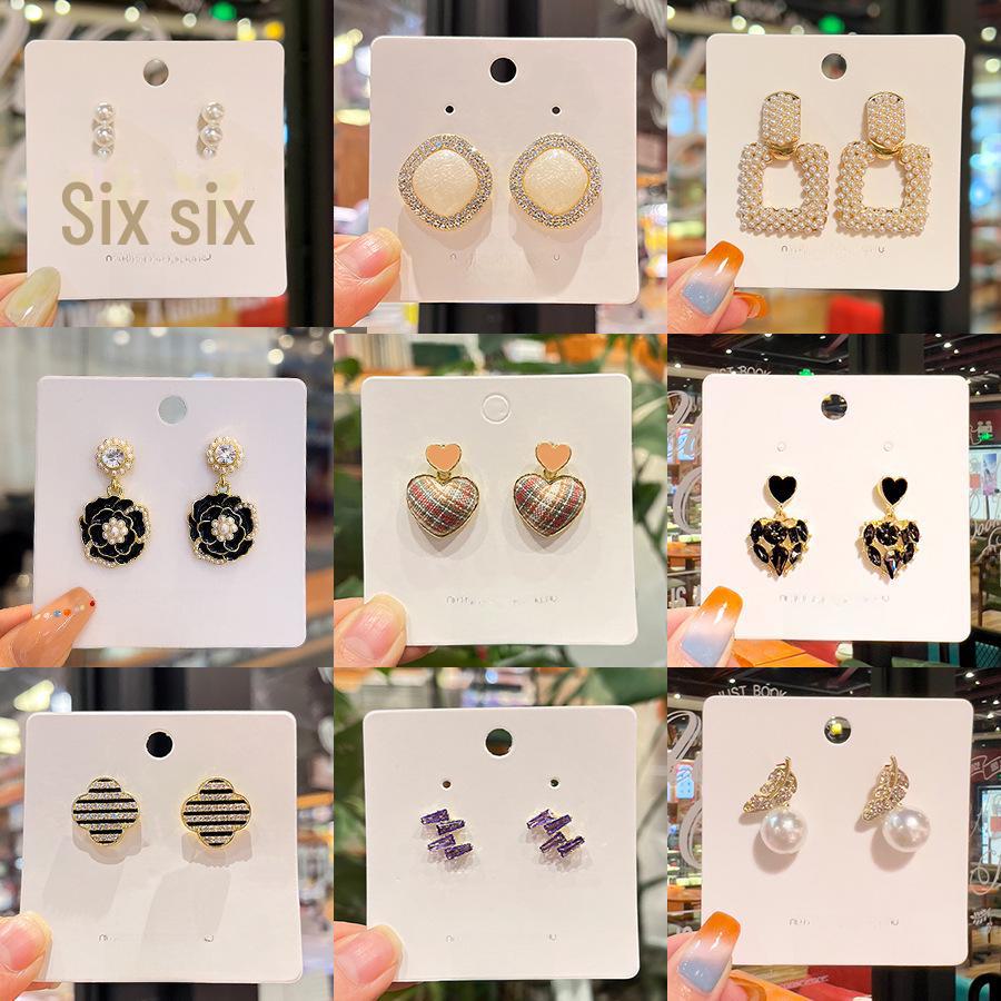 «Серьги-бантики из серебряных игл с жемчугом и цирконием»: Нишевый дизайн, стильный и универсальный, легкий роскошный аксессуар высокого класса.