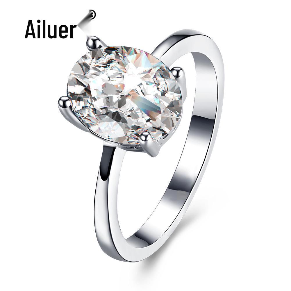 Женское кольцо-бестселлер из белого золота с овальным цирконом и кристаллами