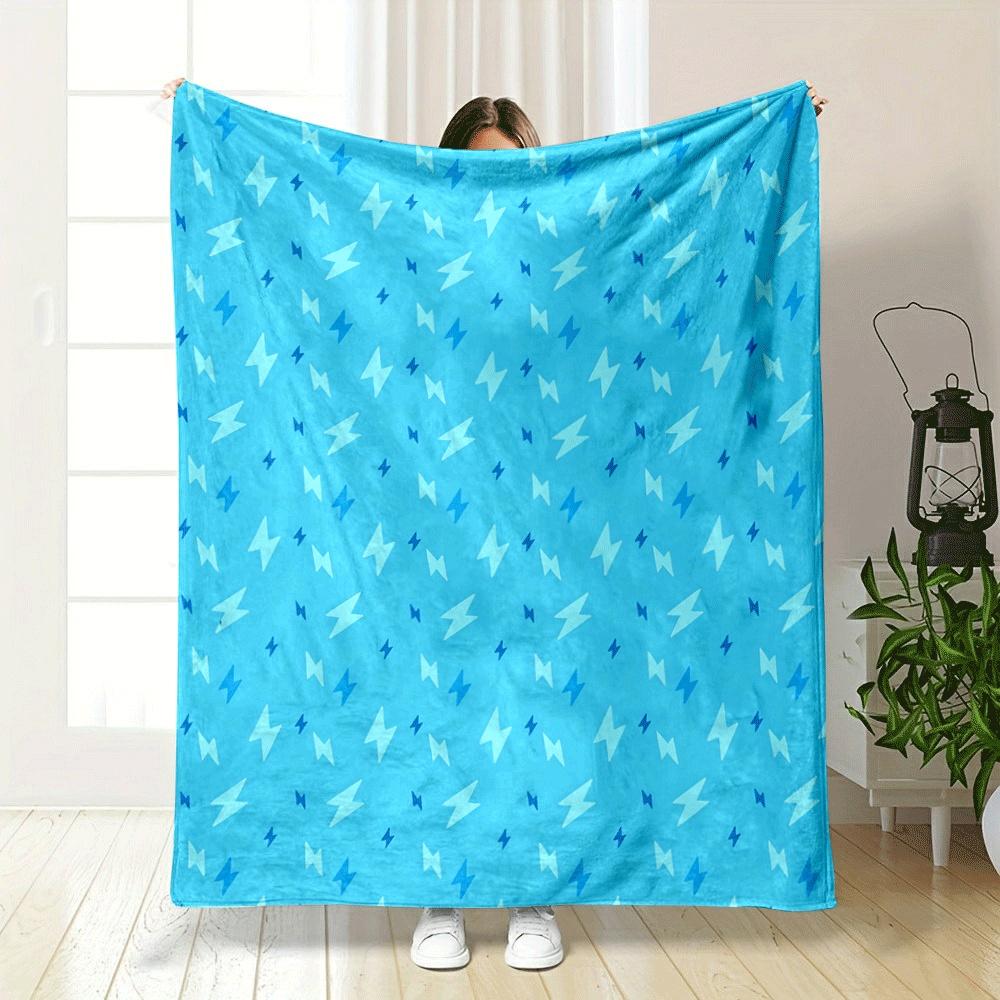The pattern consists of scattered lightning bolt shapes in varying blue tones. for all seasons blanket lunch break throw gift