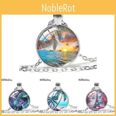 Красивое посеребренное ожерелье с художественной подвеской в виде парижской Эйфелевой башни и на морскую тематику