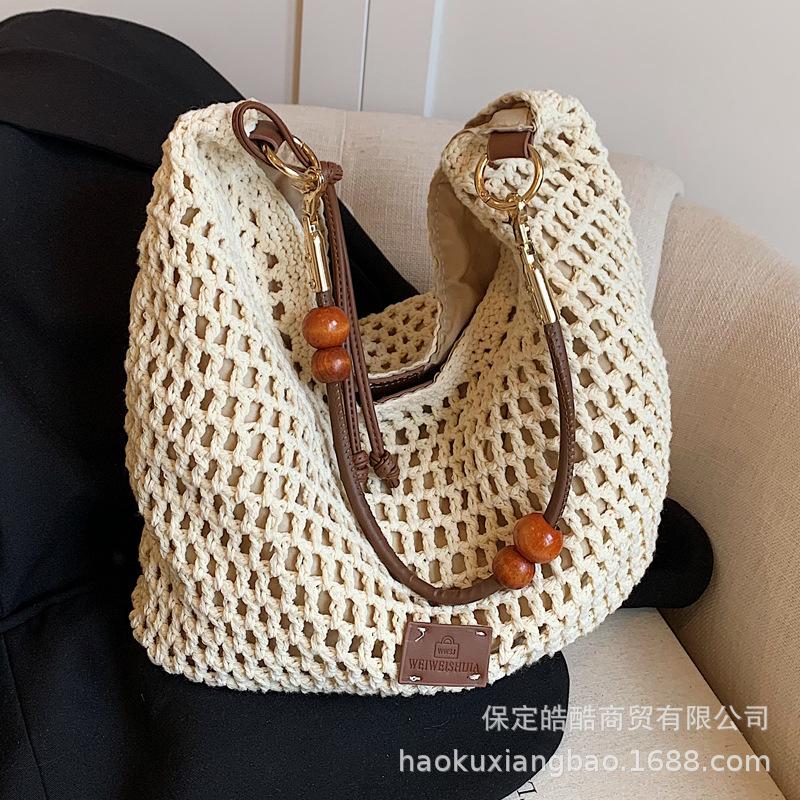 Woven hollow bag women's 2025 new spring and summer seaside vacation travel tote bag beach bag shoulder armpit bag