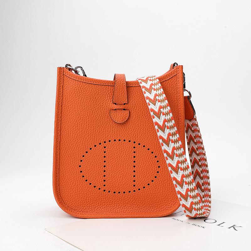 Фабричная оптовая продажа сумка-ведро из натуральной коровьей кожи первого слоя женская сумка с узором личи полый дизайн на одно плечо через плечо полый дизайн