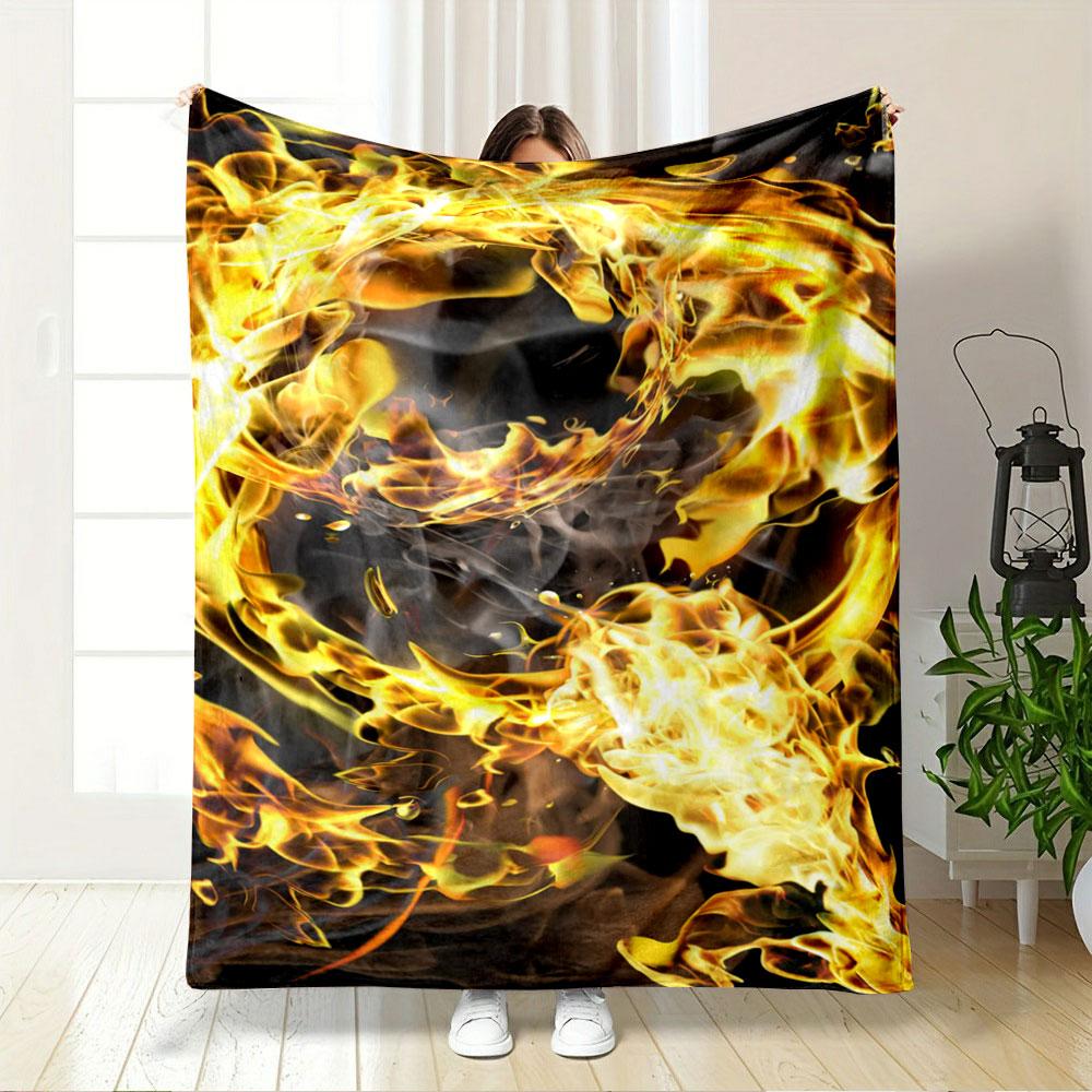A swirling pattern of vibrant yellow and orange flames with smoky accents. for all seasons blanket lunch break throw gift