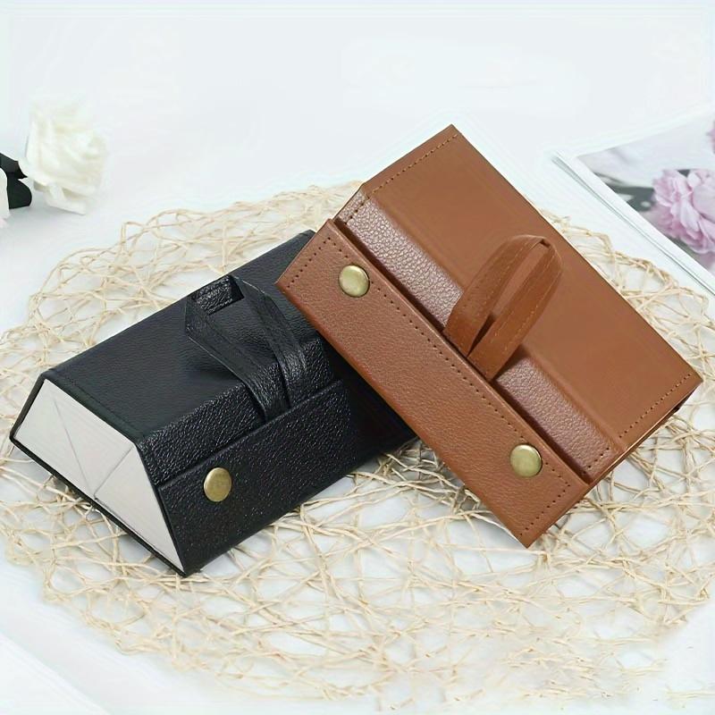 This sturdy faux leather foldable glasses case has snap closure and multi compartments Stylish black-white design, portable unisex eyewear storage box
