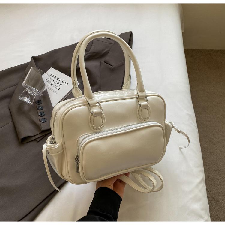 Рюкзак Женский рюкзак 2025 Новый Большая вместимость Нишевый Простой Городской Колледж Колледжный стиль Кожаная школьная сумка