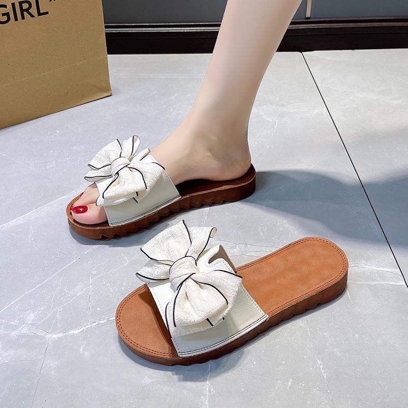 2024Крутые тапочки для женщин, носящих летние универсальные пляжные туфли с бантом и подошвой из сухожилий с плоской подошвой и нескользящие шлепанцы