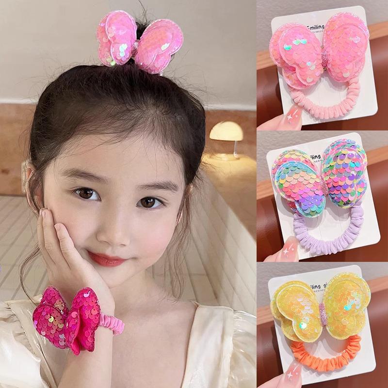 Детская резинка для волос с пайетками в виде бабочки не повредит волосы. Идеально подходит для высоких хвостов или в качестве головного убора для девочек.