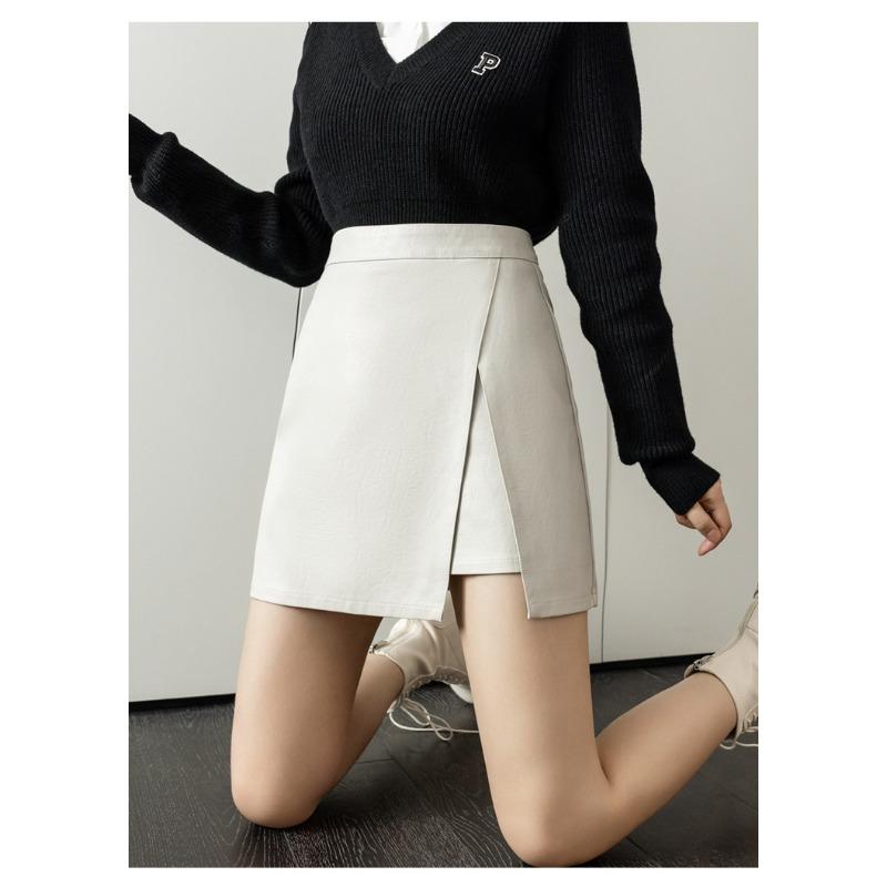 Осенне-зимняя женская юбка из искусственной кожи, короткая юбка, нерегулярная открытая вилка, тонкий дизайн, высокая талия, посылка на бедрах