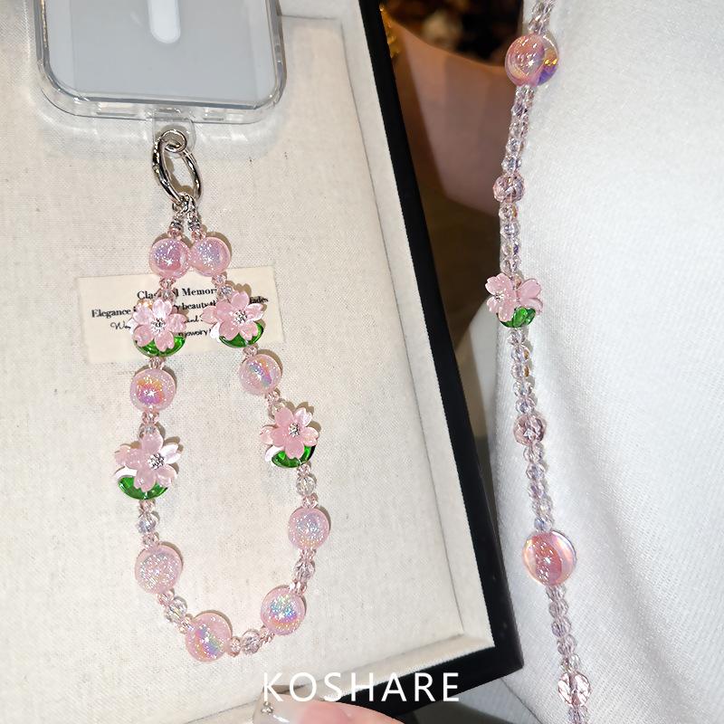 Peach blossom flash messenger mobile phone chain light luxury high-end crystal hanging chain fashionable anti-drop hand carry pendant female beads