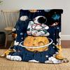 A meditating astronaut sits on a ringed planet amid whimsical space objects. for all seasons blanket lunch break throw gift
