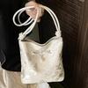 Korean niche bow women's bag 2025 new summer shoulder armpit bag fashionable high-value portable bucket bag
