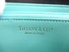 Подлинная Tiffany & Co.. Кошелек на молнии, круглый, из черной кожи, с металлической пластиной-логотипом #a871 Восстановленный