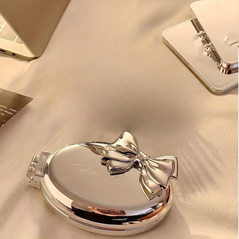 Портативная мини-расческа для волос в форме бантика - Нейлоновая щетина, складная, с воздушной подушкой для нормальных волос, дорожный инструмент для укладки с зеркалом