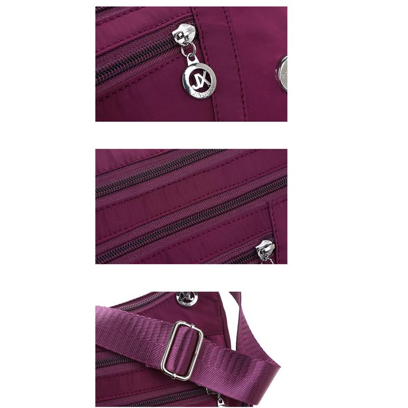 Женская нейлоновая сумка. Много карманов на молнии. Регулируемый ремешок через плечо