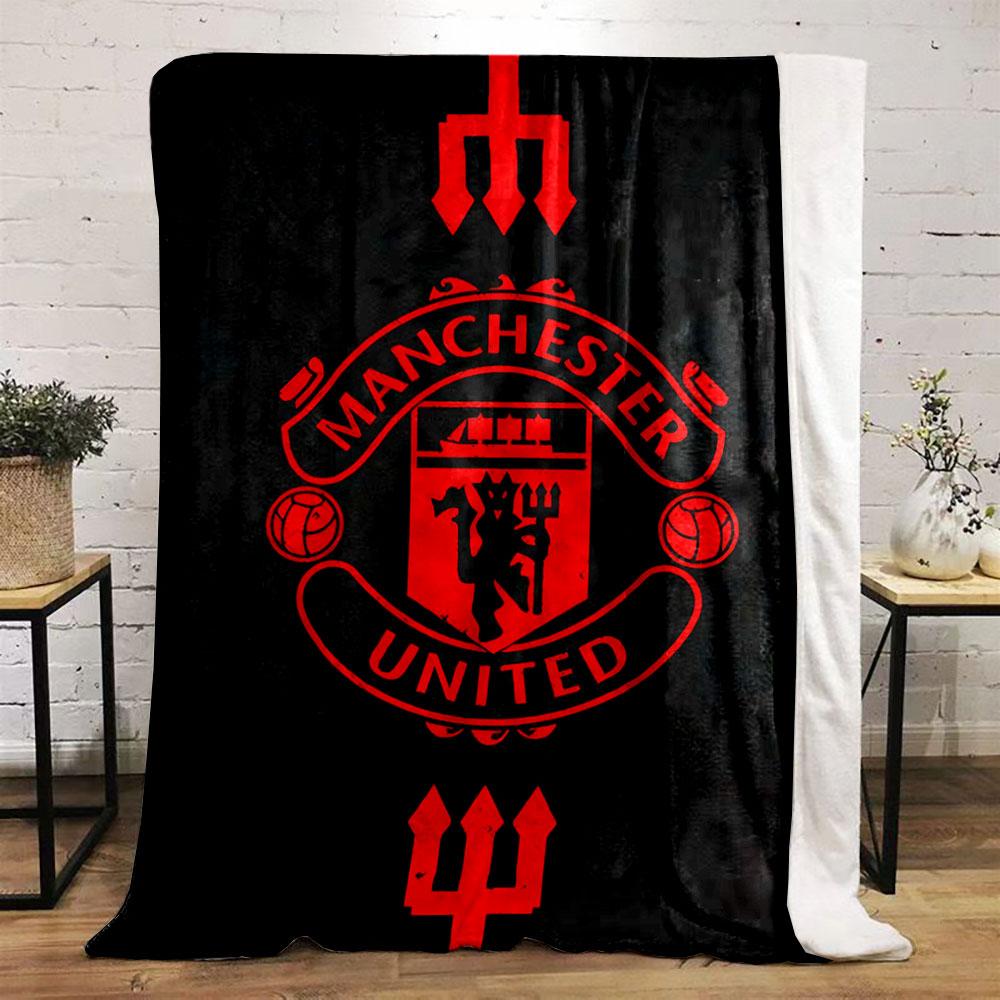 A red Manchester United emblem with tridents on a black background. for all seasons blanket lunch break throw gift