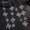 Новое полое ожерелье из сплава в виде четырехлистного клевера, гальванизированное золотом и серебром, модное женское высококлассное ожерелье с длинной подвеской в виде лепестка