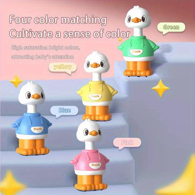 A Cartoon-shaped Sliding Toy, a Little Yellow Duck, That Bounces Back When the Youngsters Pushes It.