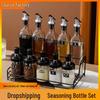 Glass Condiment Jar Set: Oil Dispenser, Seasoning Jars, and Integrated Soy Sauce Vinegar Dispenser with Spoon and Lid.