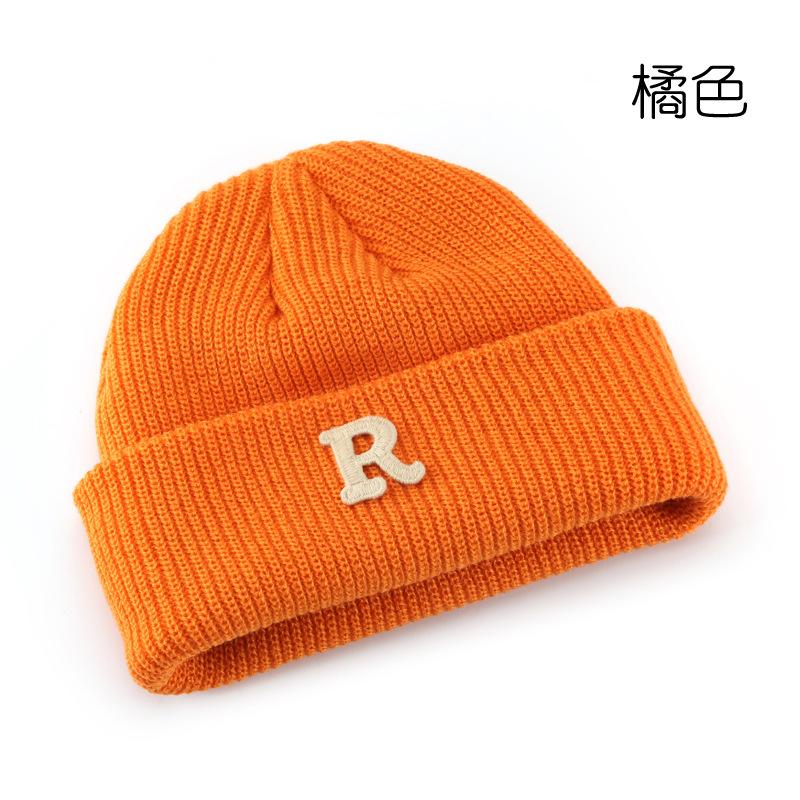 Women's Solid Color Letter Print R Rolled brim knitted hat for outdoor cycling, providing warmth, cold protection, and ear coverage