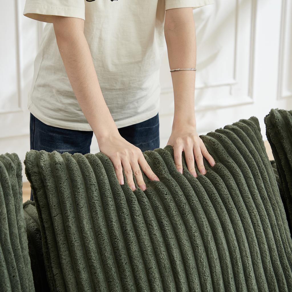 Minimalist Corduroy Sofa with Curved Lines and a Gently Sloping Backrest, Complete with Two Cushions.