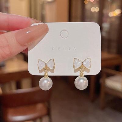 Серьги-бантики из серебра 925 пробы с жемчугом — модный, элегантный, универсальный дизайн