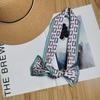 Korean version of the new tied bag thin and narrow strip small silk scarf women's printing creative small scarf women's four-season streamer wholesale