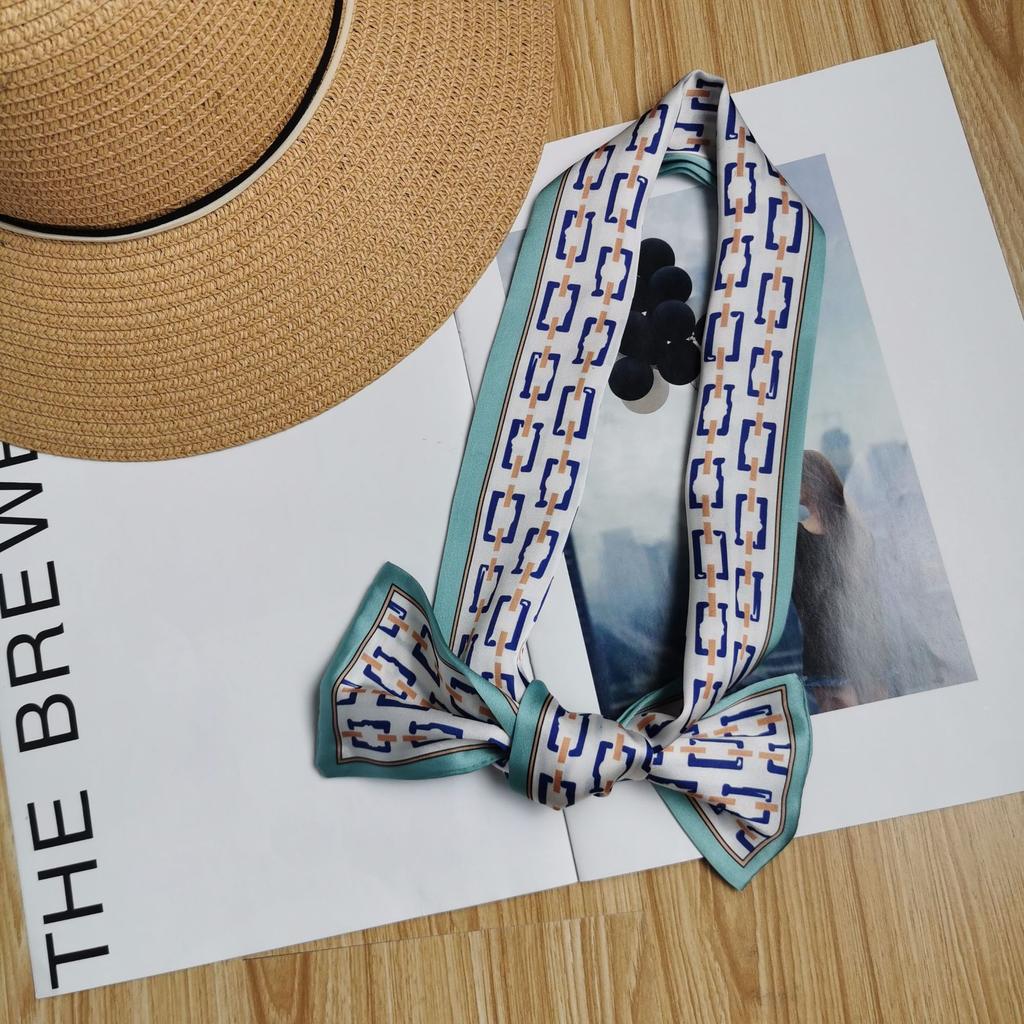 Korean version of the new tied bag thin and narrow strip small silk scarf women's printing creative small scarf women's four-season streamer wholesale