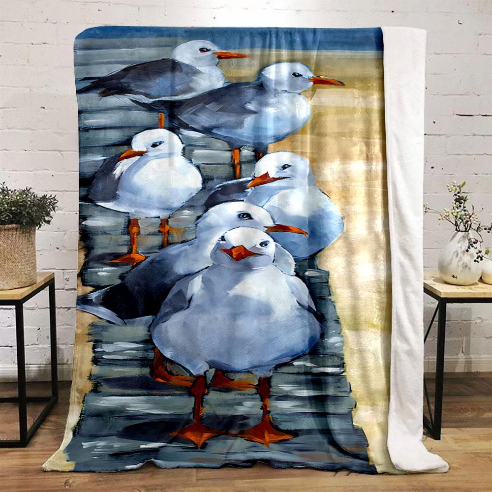 Seagulls with white and gray feathers standing on a wooden walkway. for all seasons blanket lunch break throw gift