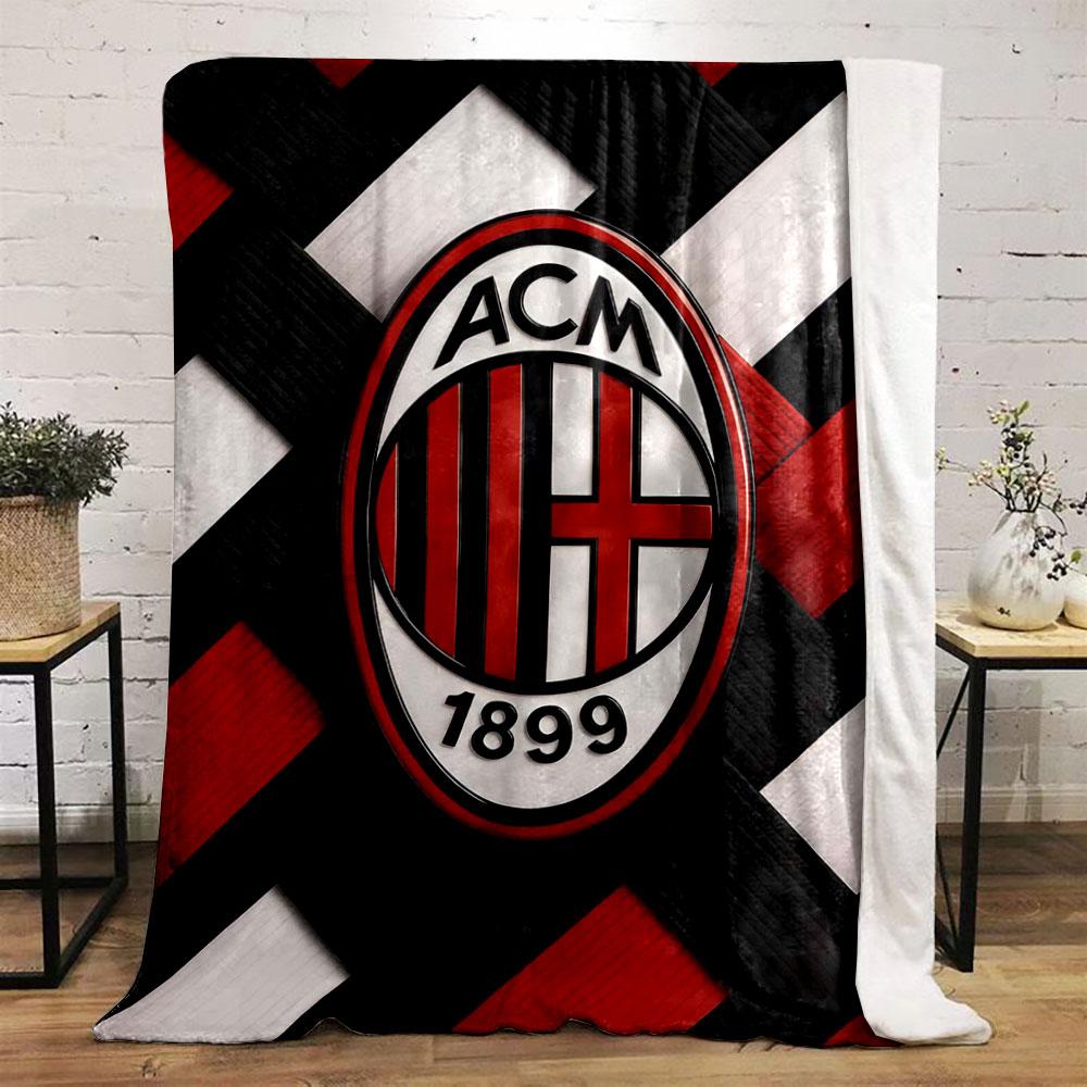 Interwoven red, black, and white strips with an oval emblem in the center. for all seasons blanket lunch break throw gift